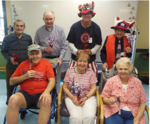 group of people dressed in red, white and blue attire 